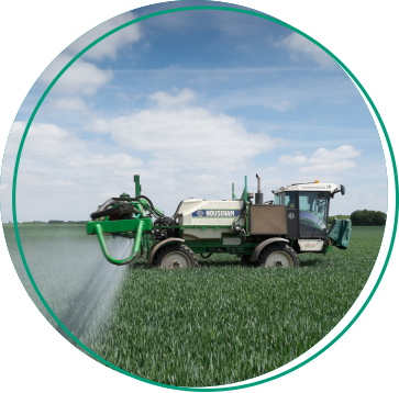 merlin sprayer spraying a field of wheat