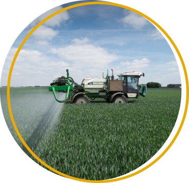agricultural sprayer in a field of winter wheat
