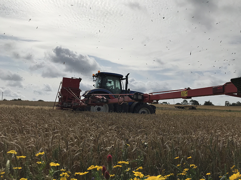 image of farm machinery in wheat field 